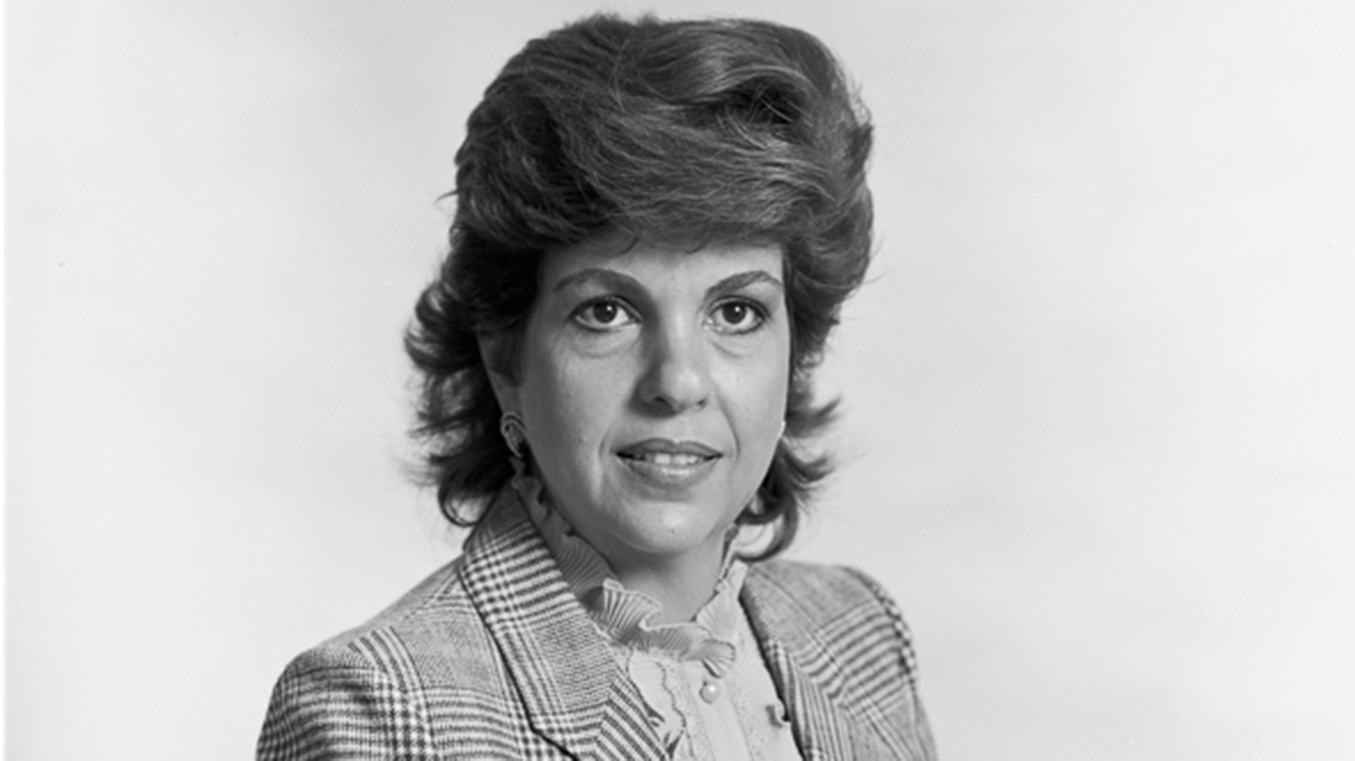 A black and white closeup of a lady