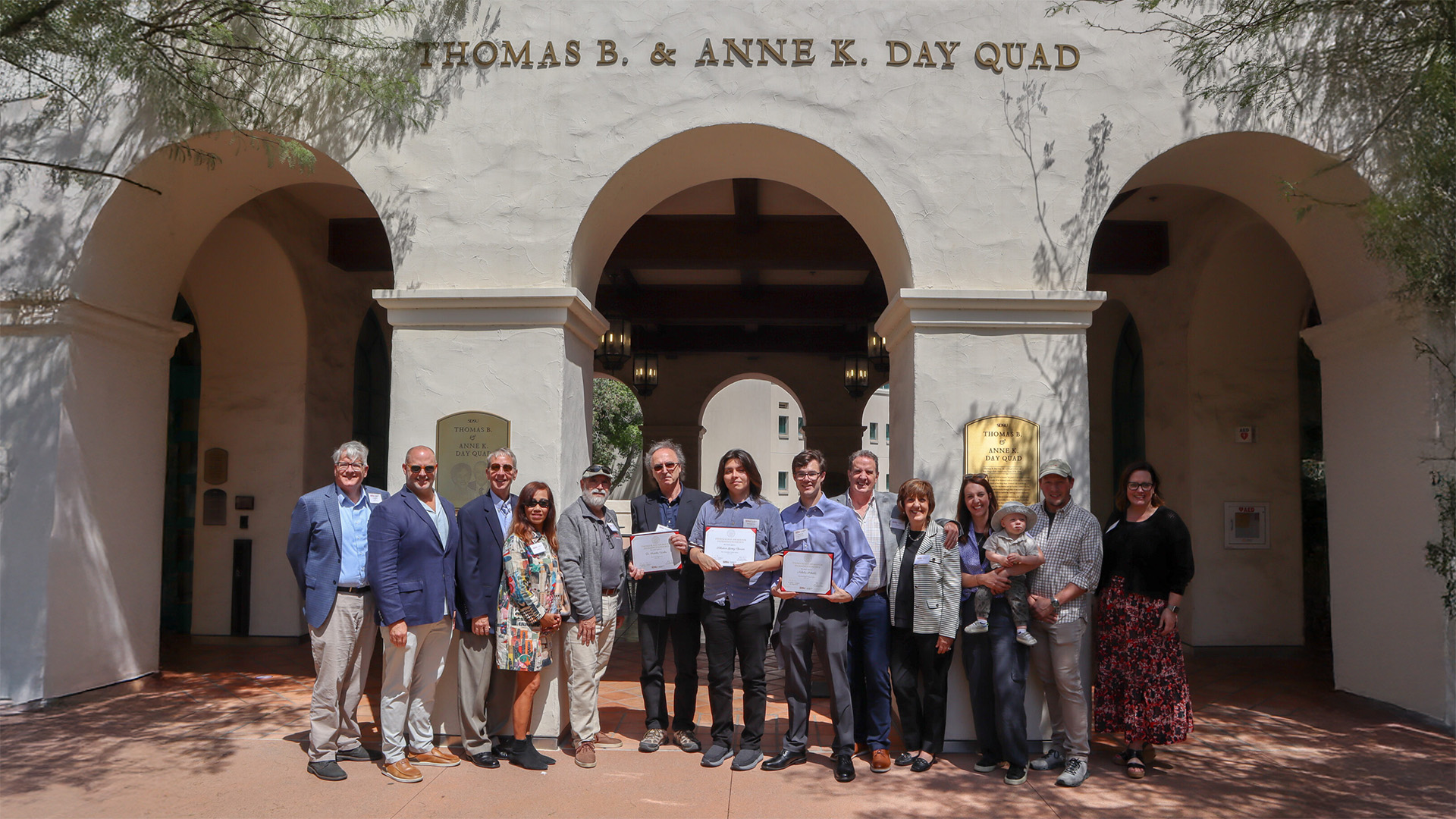 Dean Jeffrey Roberts, Adam Day, Brad Pitzer, Toy Pitzer, Sam Crivello, Professor Fridolin Weber, Sebastian Gomez-Barron, Nicholas Schottle, Tim Day, Krista Day, Meghan Day, Andrew Bollman and Vice Provost Sonjia Pruitt-Lord in Thomas B. & Anne K. Day Quad