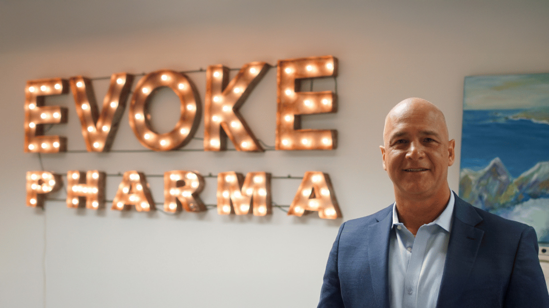 EVOKE PHARMA sign on wall behind with Matt D'Onofrio in foreground.
