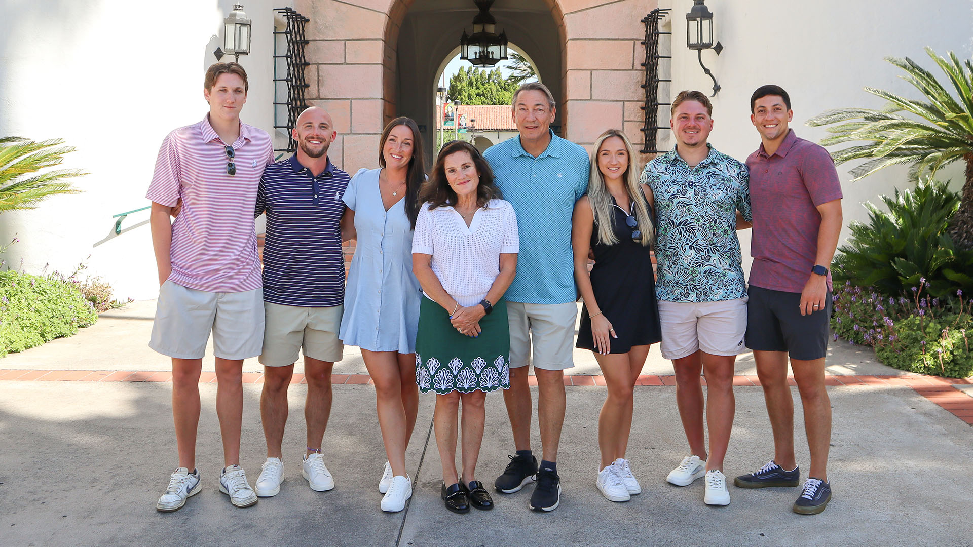 Helen Corley poses with 7 of her family members outside.