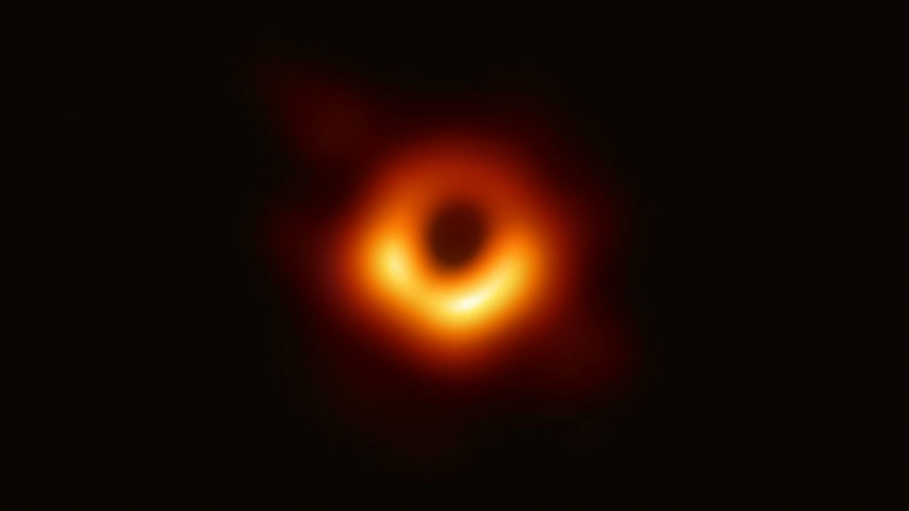 Dark Space with blurry orange ring.