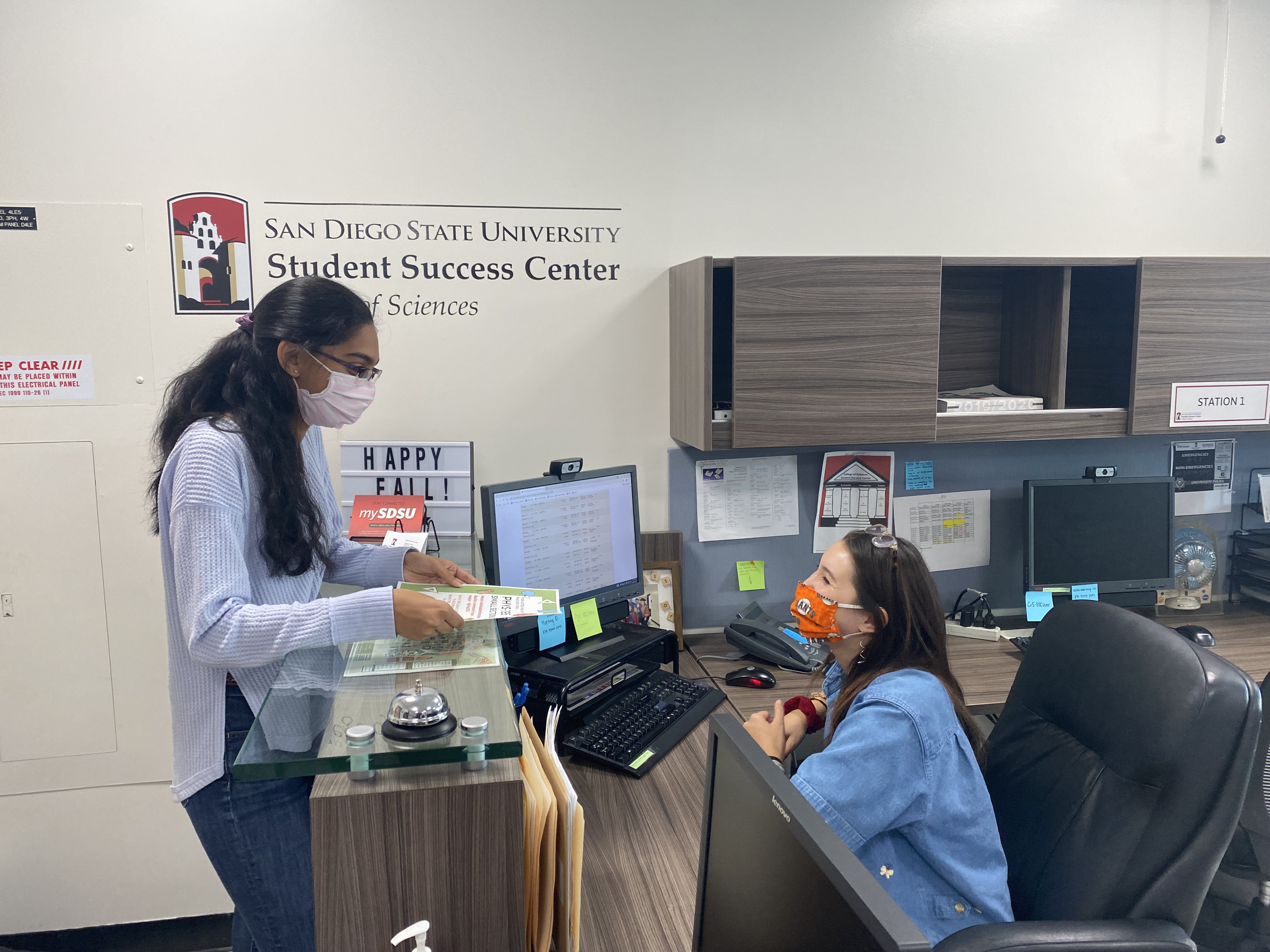 Two students wearing mask at the Student Success Center