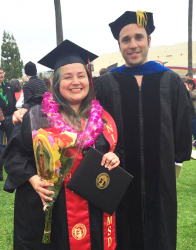 Diana stands with Dr. Luque at her undergraduate graduation