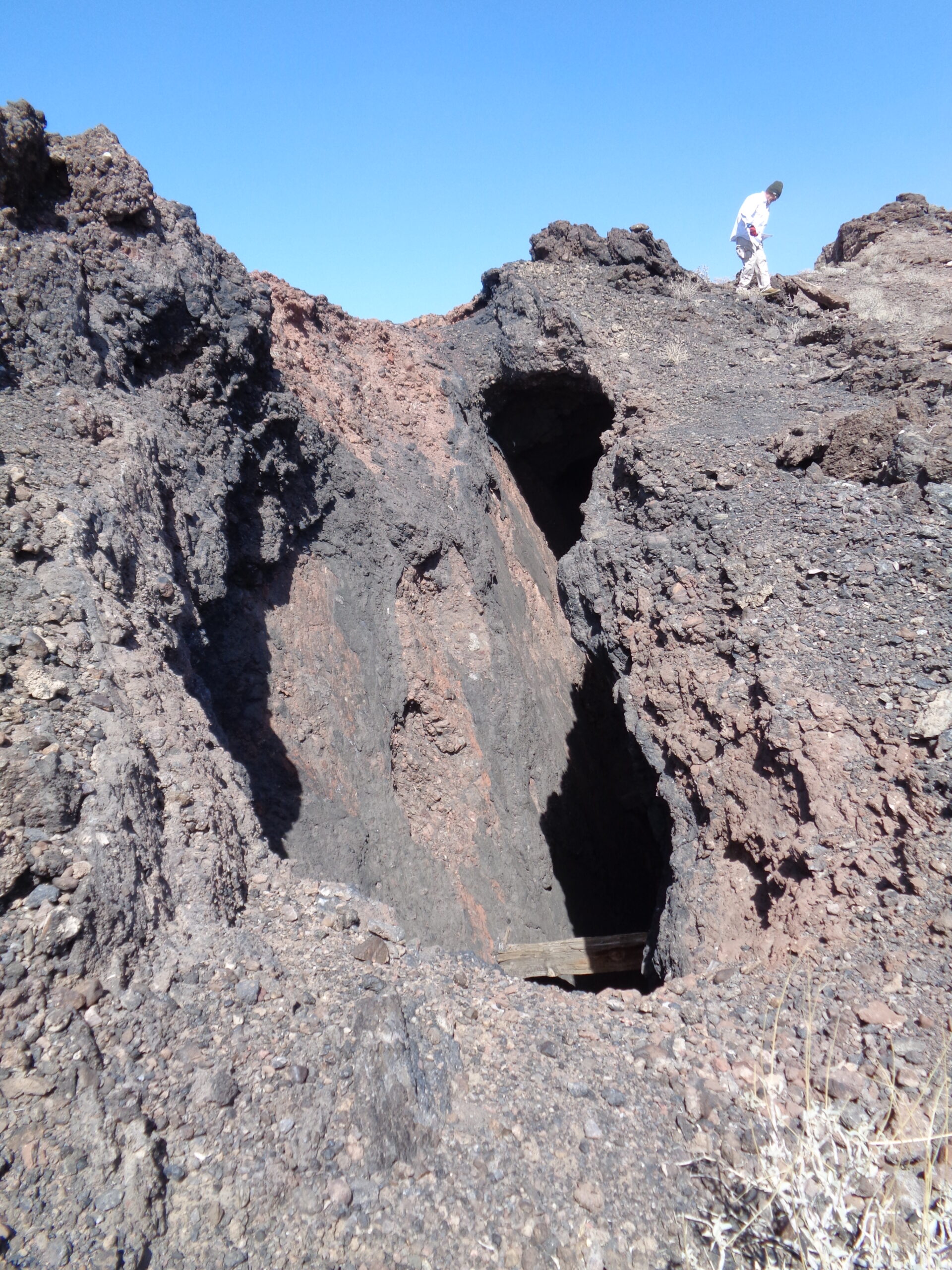 An old mine shaft with streaks of manganese