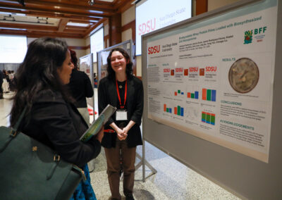 Student explains her chemistry research poster