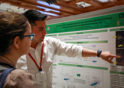 Student explains his biology research poster