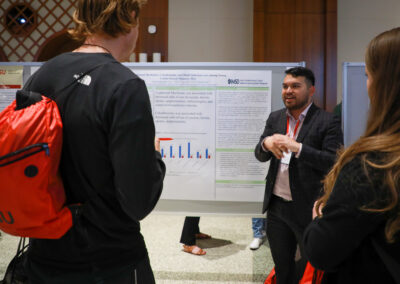 Student explains his psychology research to audience