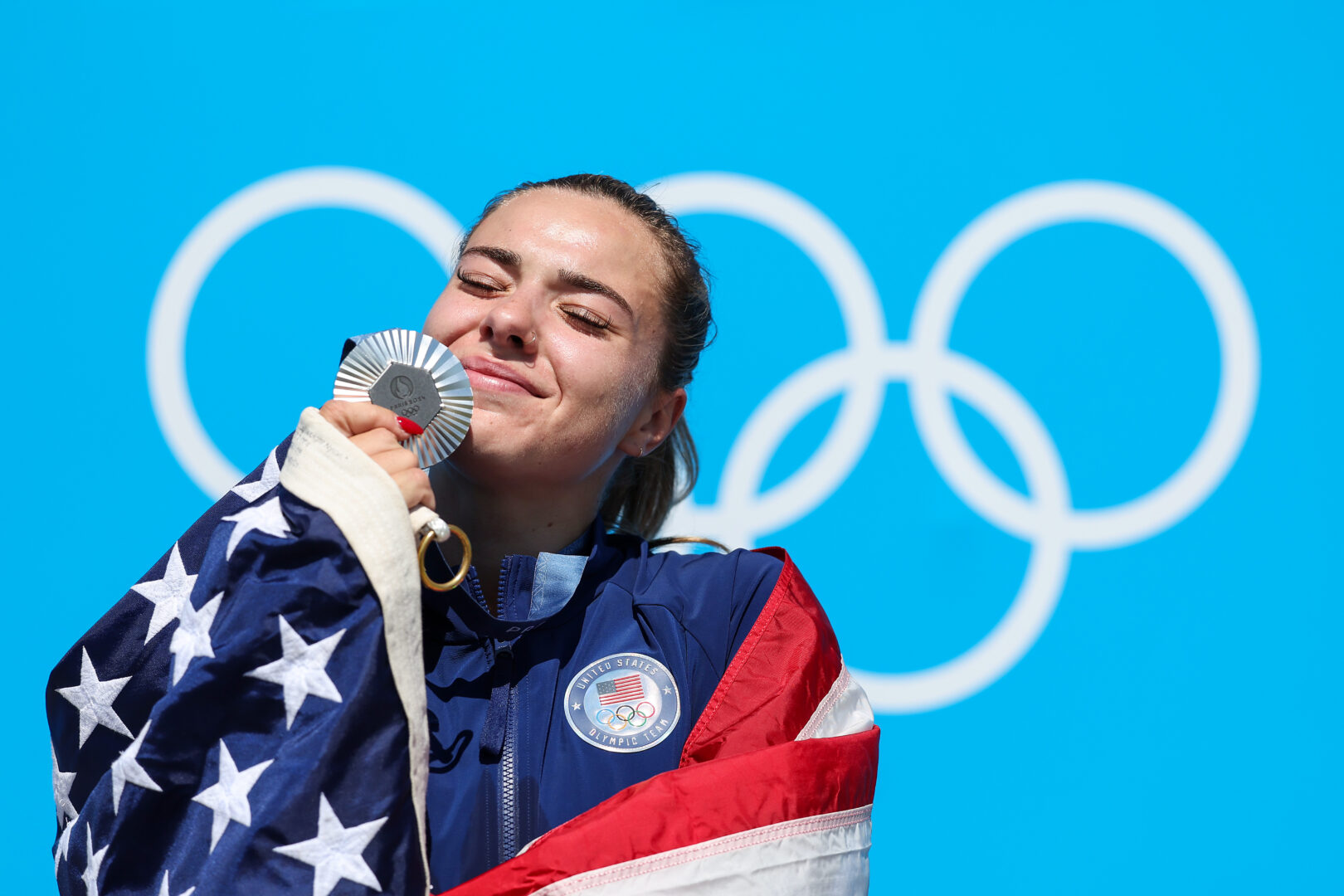 Silver medalist Nevin Harrison of Team United States celebrates on the podium during the Women's Canoe Single 200m medal ceremony after the Women's Canoe Single 200m Final on day fifteen of the Olympic Games Paris 2024 at Vaires-Sur-Marne Nautical Stadium on August 10, 2024 in Paris, France. (Photo by Charles McQuillan/Getty Images)