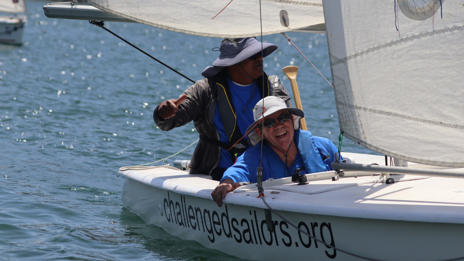 SDSU alumnus Peter Phillips sails with Challenged Sailors on San Diego Harbor 