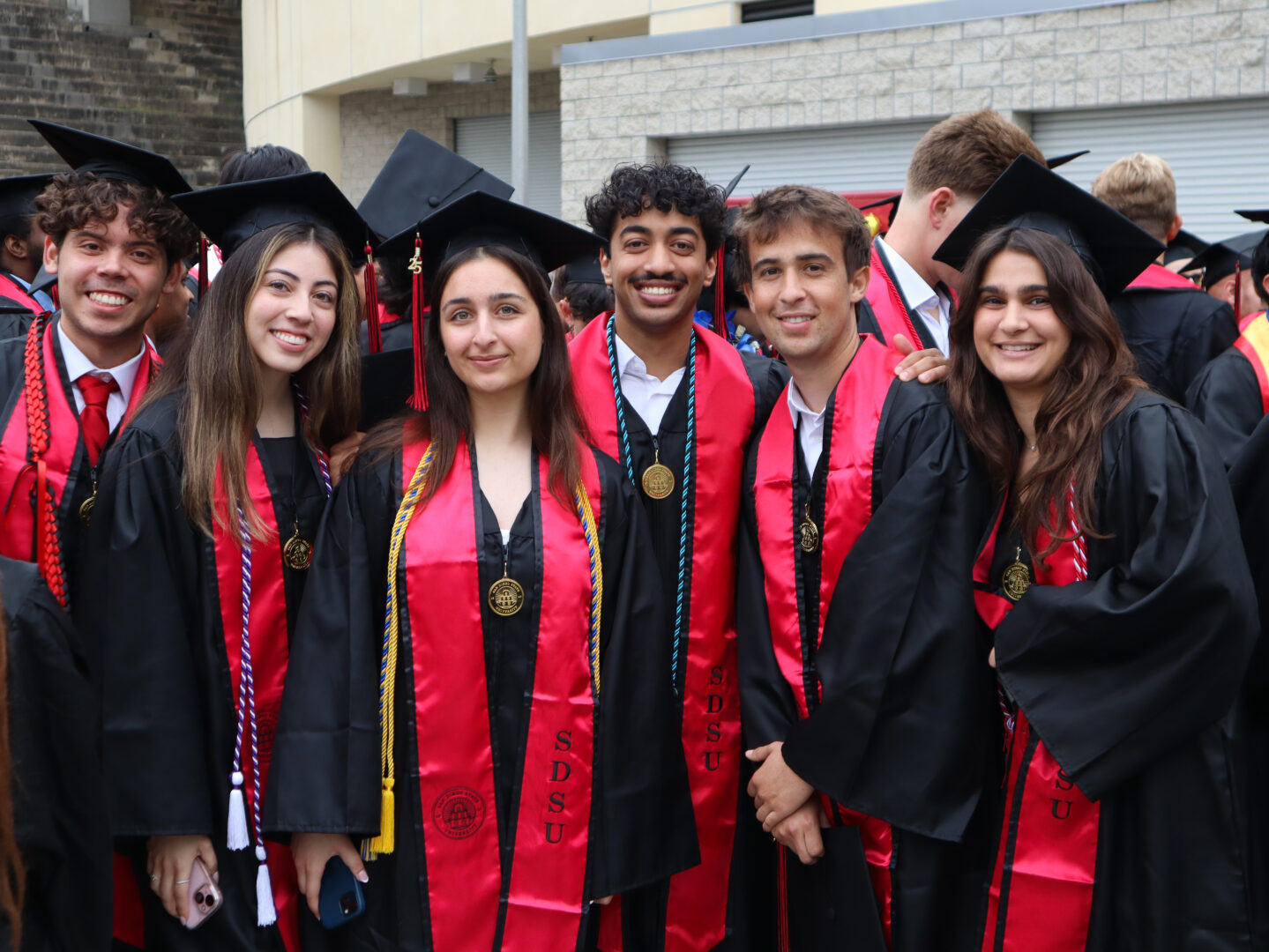 College of Sciences 2025 grads pose for a photo during Commencement